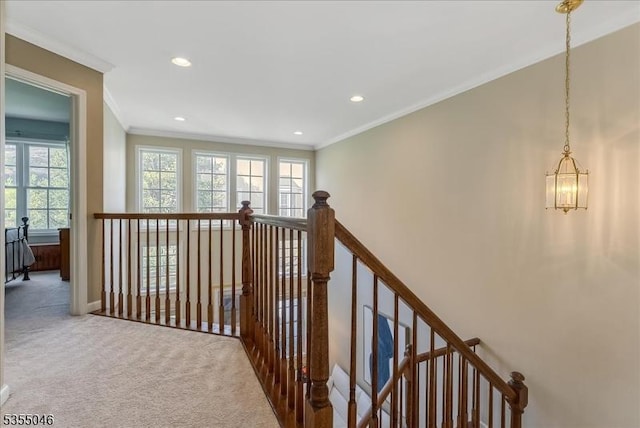 corridor featuring crown molding, carpet floors, baseboards, and recessed lighting