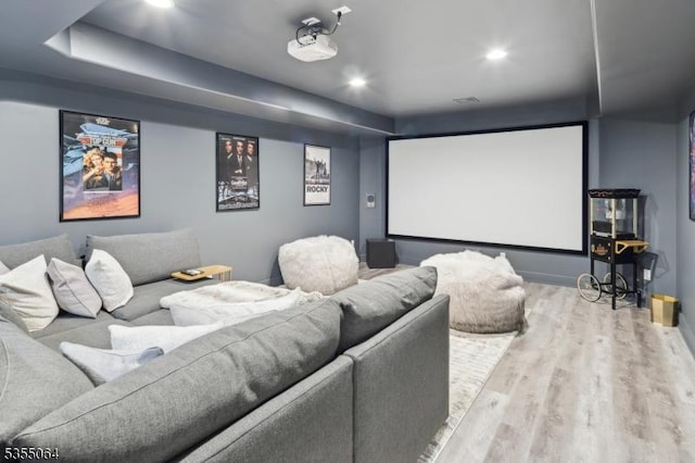 cinema room featuring wood finished floors and recessed lighting