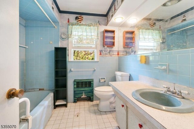 2 Woods End Rd, Parsippany-Troy Hills Twp, NJ 07950 - full bath with tile patterned flooring, vanity, toilet, tile walls, and heating unit