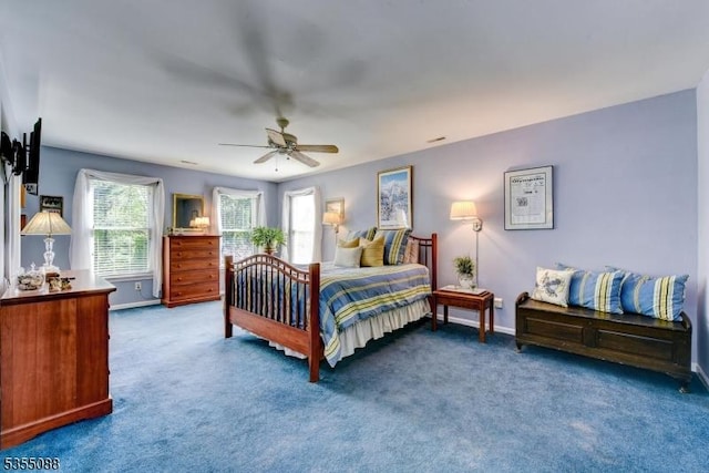 bedroom featuring carpet floors, baseboards, and ceiling fan