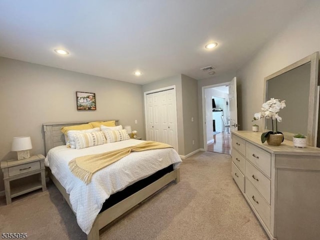 bedroom featuring visible vents, a closet, baseboards, light colored carpet, and recessed lighting