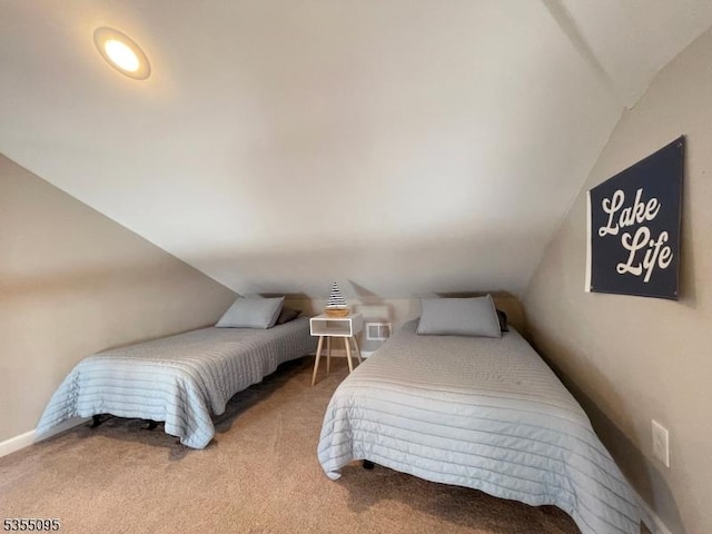 carpeted bedroom featuring lofted ceiling