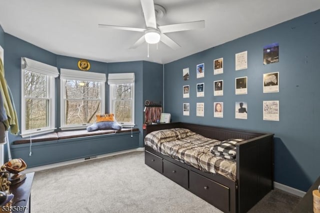 carpeted bedroom with baseboards and ceiling fan