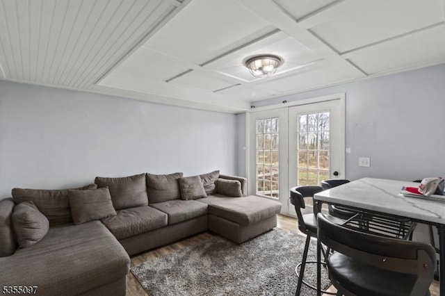 living area with french doors, wood finished floors, and coffered ceiling