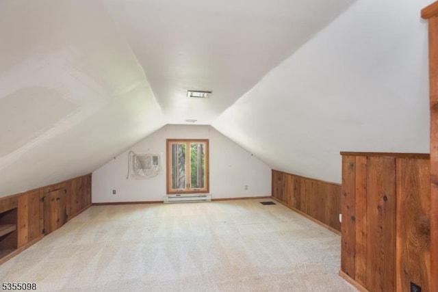 22 Pine Hill Rd, Delaware Twp, NJ 08559 - additional living space featuring wood walls, a wall mounted air conditioner, visible vents, vaulted ceiling, and baseboard heating