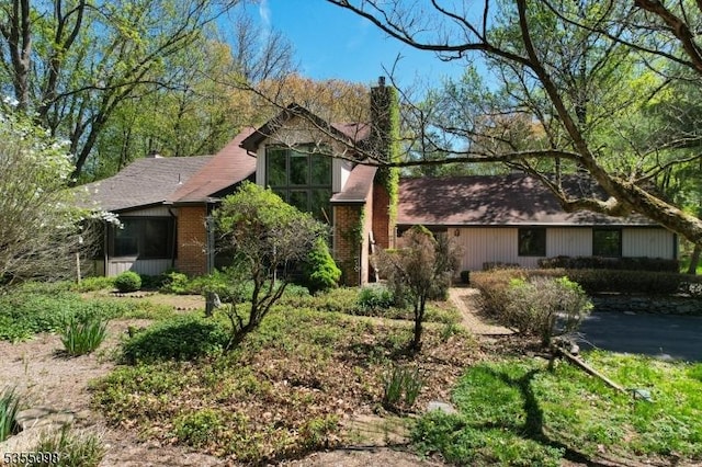 22 Pine Hill Rd, Delaware Twp, NJ 08559 - view of front facade with a chimney and brick siding
