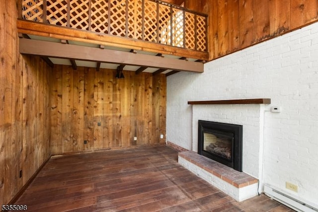 22 Pine Hill Rd, Delaware Twp, NJ 08559 - unfurnished living room with wood walls, hardwood / wood-style floors, beam ceiling, a fireplace, and baseboard heating
