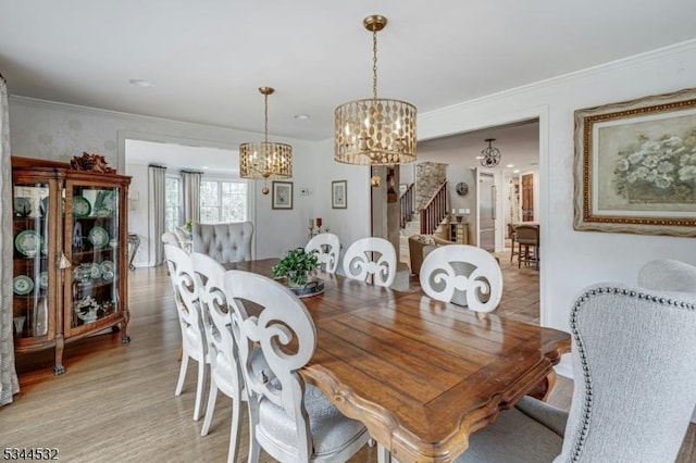 1251 Rahway Rd, Scotch Plains Twp, NJ 07076 - dining room featuring crown molding, light wood-style flooring, stairs, and a notable chandelier