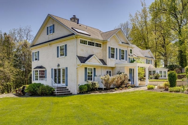 1251 Rahway Rd, Scotch Plains Twp, NJ 07076 - rear view of house with a lawn, stucco siding, french doors, and a chimney