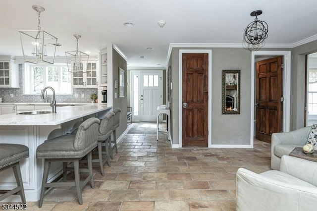 1251 Rahway Rd, Scotch Plains Twp, NJ 07076 - interior space with a kitchen breakfast bar, a chandelier, glass insert cabinets, and a sink