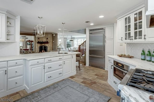 1251 Rahway Rd, Scotch Plains Twp, NJ 07076 - kitchen featuring a sink, stainless steel appliances, open floor plan, white cabinetry, and glass insert cabinets
