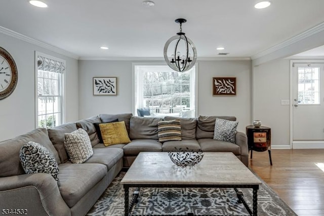 1251 Rahway Rd, Scotch Plains Twp, NJ 07076 - living room with recessed lighting, ornamental molding, wood finished floors, and a notable chandelier