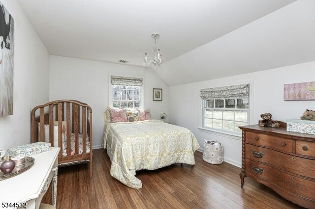 1251 Rahway Rd, Scotch Plains Twp, NJ 07076 - bedroom with dark wood-style flooring, visible vents, vaulted ceiling, baseboards, and an inviting chandelier