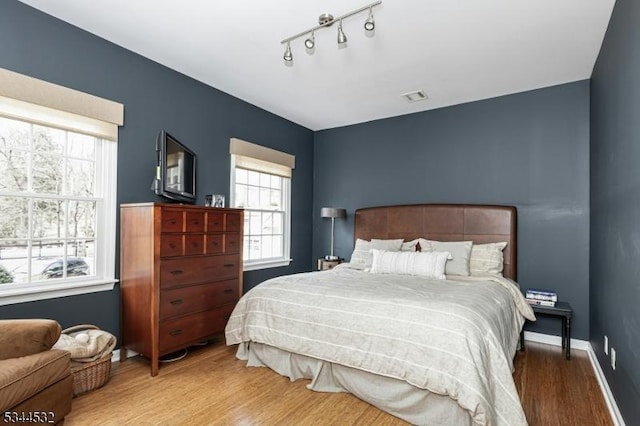 1251 Rahway Rd, Scotch Plains Twp, NJ 07076 - bedroom with visible vents, baseboards, and wood finished floors