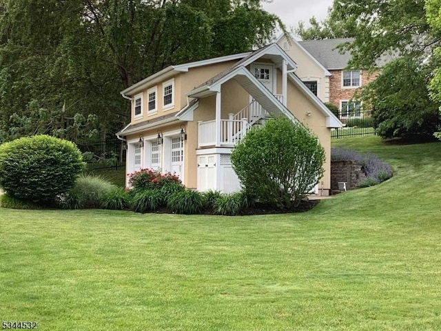 1251 Rahway Rd, Scotch Plains Twp, NJ 07076 - view of front of property with stucco siding, a front yard, and fence