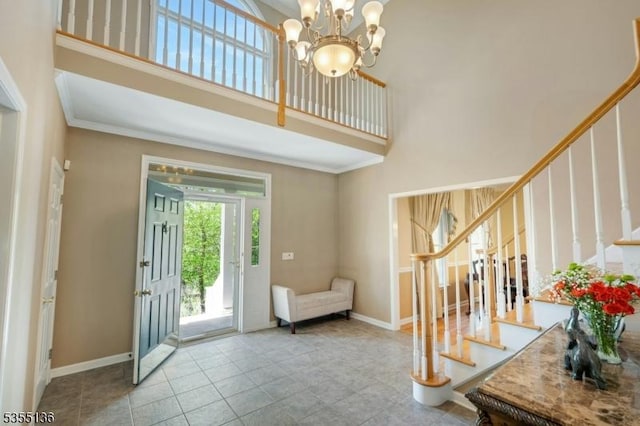 63 Twin Oaks Rd, Bridgewater Twp, NJ 08807 - entrance foyer featuring a chandelier, crown molding, stairway, and a towering ceiling