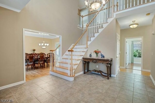 63 Twin Oaks Rd, Bridgewater Twp, NJ 08807 - staircase featuring a chandelier, tile patterned flooring, and a high ceiling