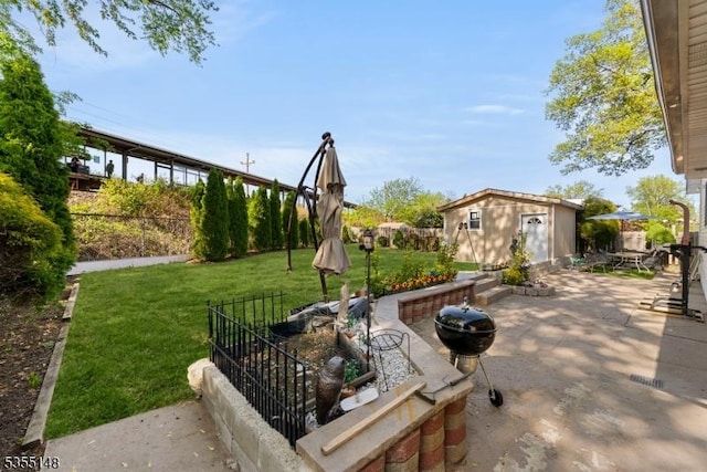 view of patio with an outdoor structure and fence