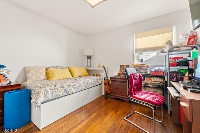 bedroom featuring wood finished floors