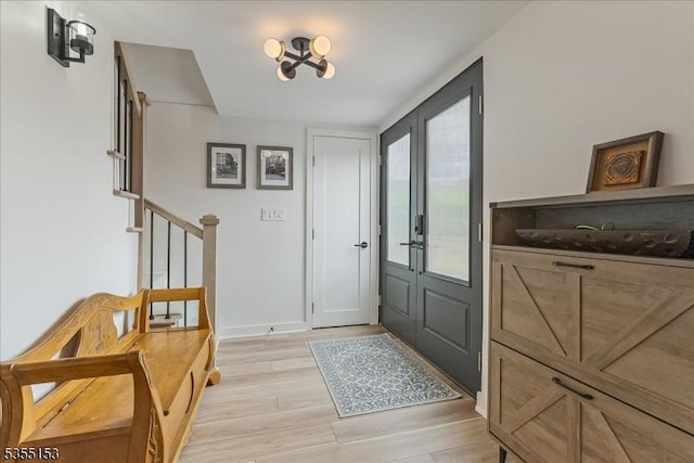 36 Island Trl, Sparta Twp, NJ 07871 - foyer entrance with baseboards, light wood-style flooring, and stairs