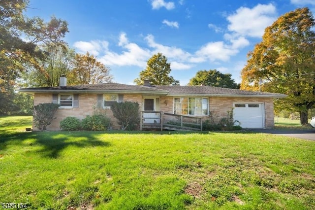 369 Stamets Rd, Holland Twp, NJ 08848 - ranch-style house with driveway, a chimney, a front yard, and a garage