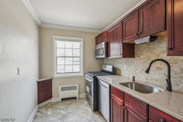 kitchen featuring a sink, radiator heating unit, stainless steel appliances, decorative backsplash, and reddish brown cabinets