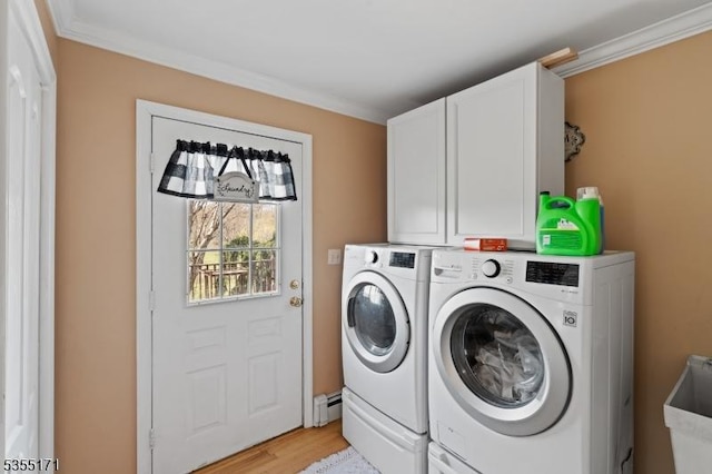581 Montgomery Rd, Hillsborough Twp, NJ 08844 - laundry area featuring washing machine and clothes dryer, crown molding, light wood-type flooring, cabinet space, and a baseboard heating unit