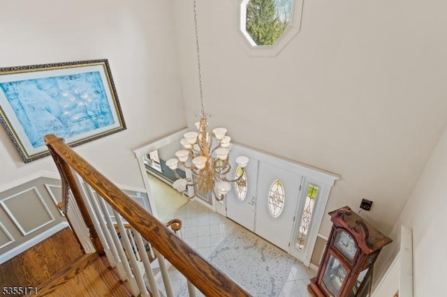 581 Montgomery Rd, Hillsborough Twp, NJ 08844 - foyer featuring a wainscoted wall, a decorative wall, and a chandelier