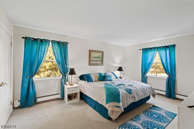 581 Montgomery Rd, Hillsborough Twp, NJ 08844 - carpeted bedroom with multiple windows and a baseboard heating unit