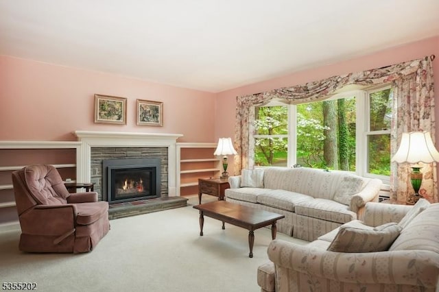 living room with carpet floors and a fireplace