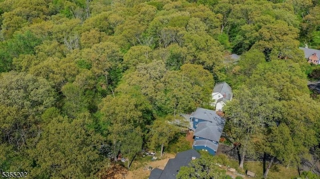 bird's eye view featuring a forest view