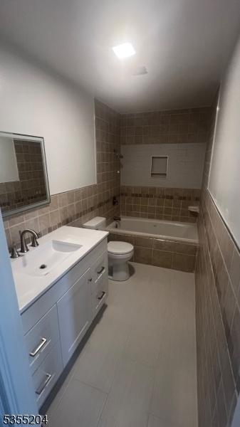 151 Pageant Ln, Willingboro Twp, NJ 08046 - full bath with tile walls, vanity, toilet, and tile patterned floors