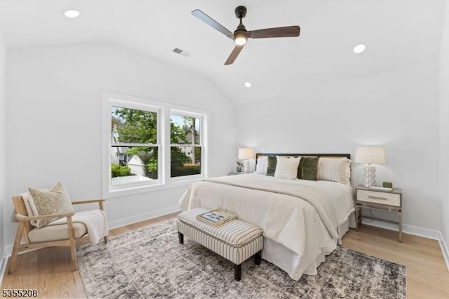 bedroom featuring recessed lighting, visible vents, light wood-style flooring, and lofted ceiling