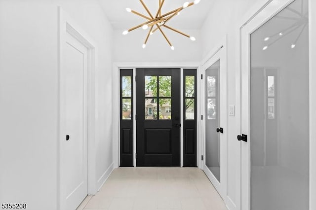 interior space featuring light tile patterned flooring and a notable chandelier