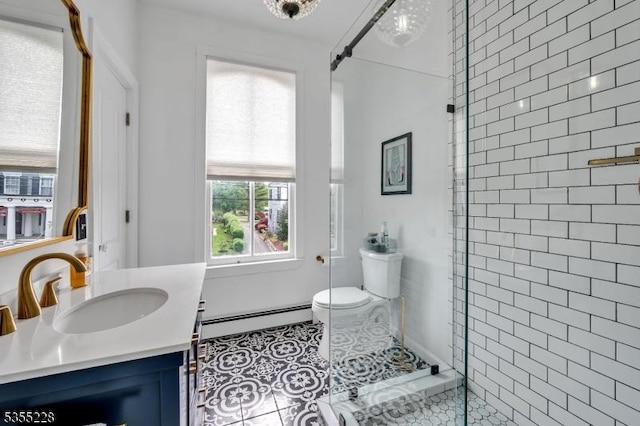 152 Main St, Flemington Boro, NJ 08822 - full bath featuring baseboard heating, walk in shower, toilet, vanity, and tile patterned floors