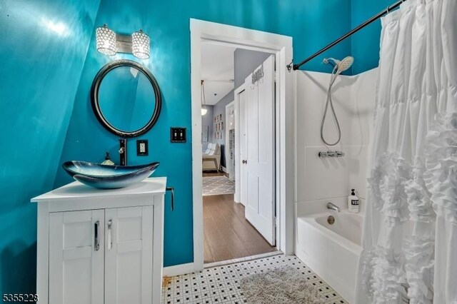 152 Main St, Flemington Boro, NJ 08822 - bathroom featuring shower / bathtub combination with curtain, vanity, and baseboards
