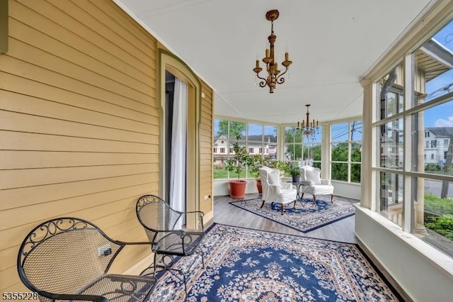 152 Main St, Flemington Boro, NJ 08822 - sunroom with a chandelier, wood finished floors, and wood walls