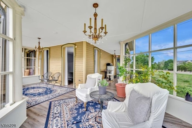 152 Main St, Flemington Boro, NJ 08822 - sunroom with a chandelier, plenty of natural light, and arched walkways