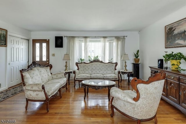 sitting room with light wood-style flooring