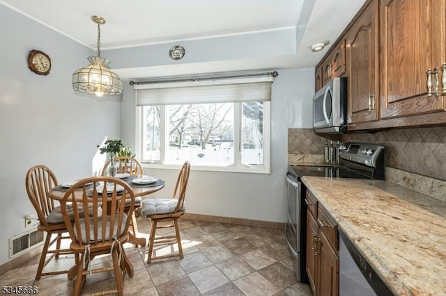 dining room with baseboards and visible vents
