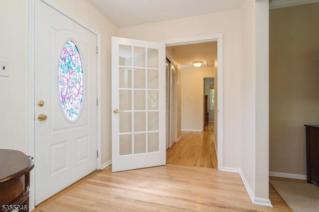 entryway featuring light wood-type flooring and baseboards