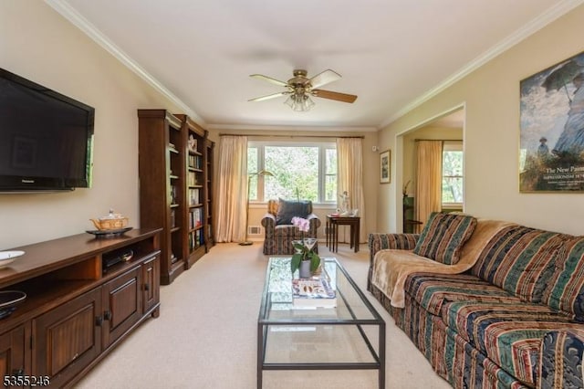living area with visible vents, ornamental molding, ceiling fan, and light carpet
