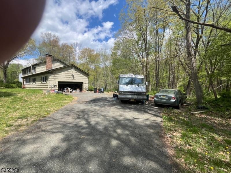 view of road with driveway