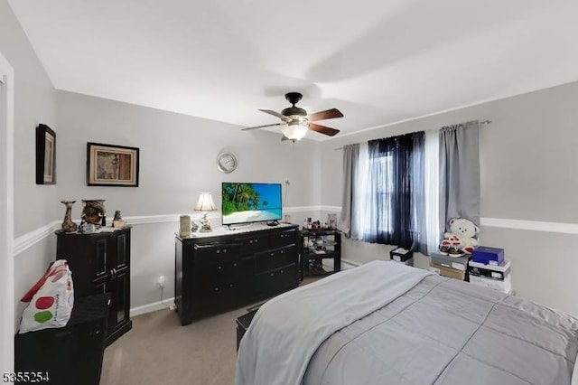 carpeted bedroom with a ceiling fan