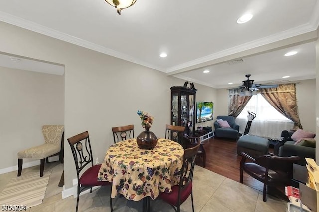 dining room featuring light tile patterned flooring, a ceiling fan, recessed lighting, ornamental molding, and baseboards