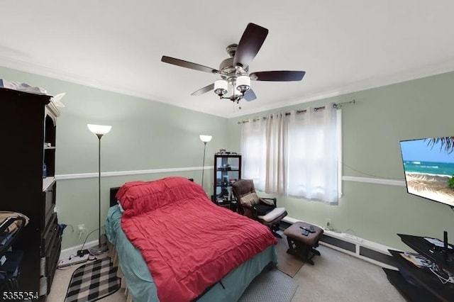 carpeted bedroom with a ceiling fan and baseboards
