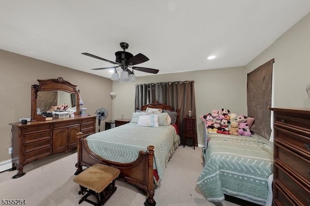 bedroom with light colored carpet, ceiling fan, recessed lighting, and baseboards