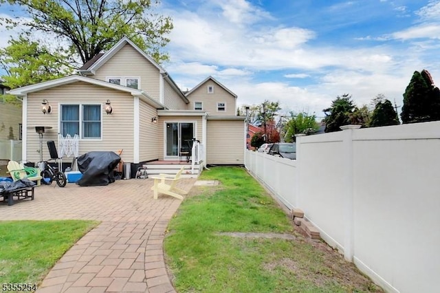 back of house featuring a patio area