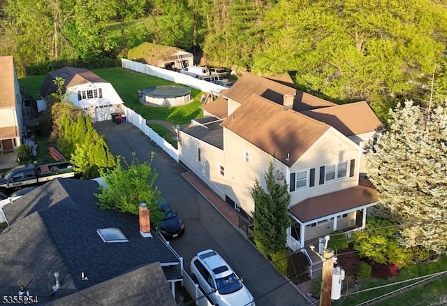 view from above of property featuring a heavily wooded area