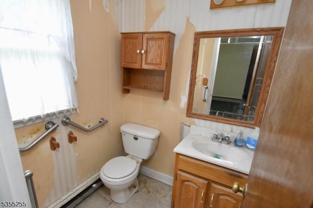 5634 Berkshire Valley Rd, Jefferson Twp, NJ 07438 - bathroom featuring toilet, vanity, tile patterned flooring, baseboard heating, and baseboards